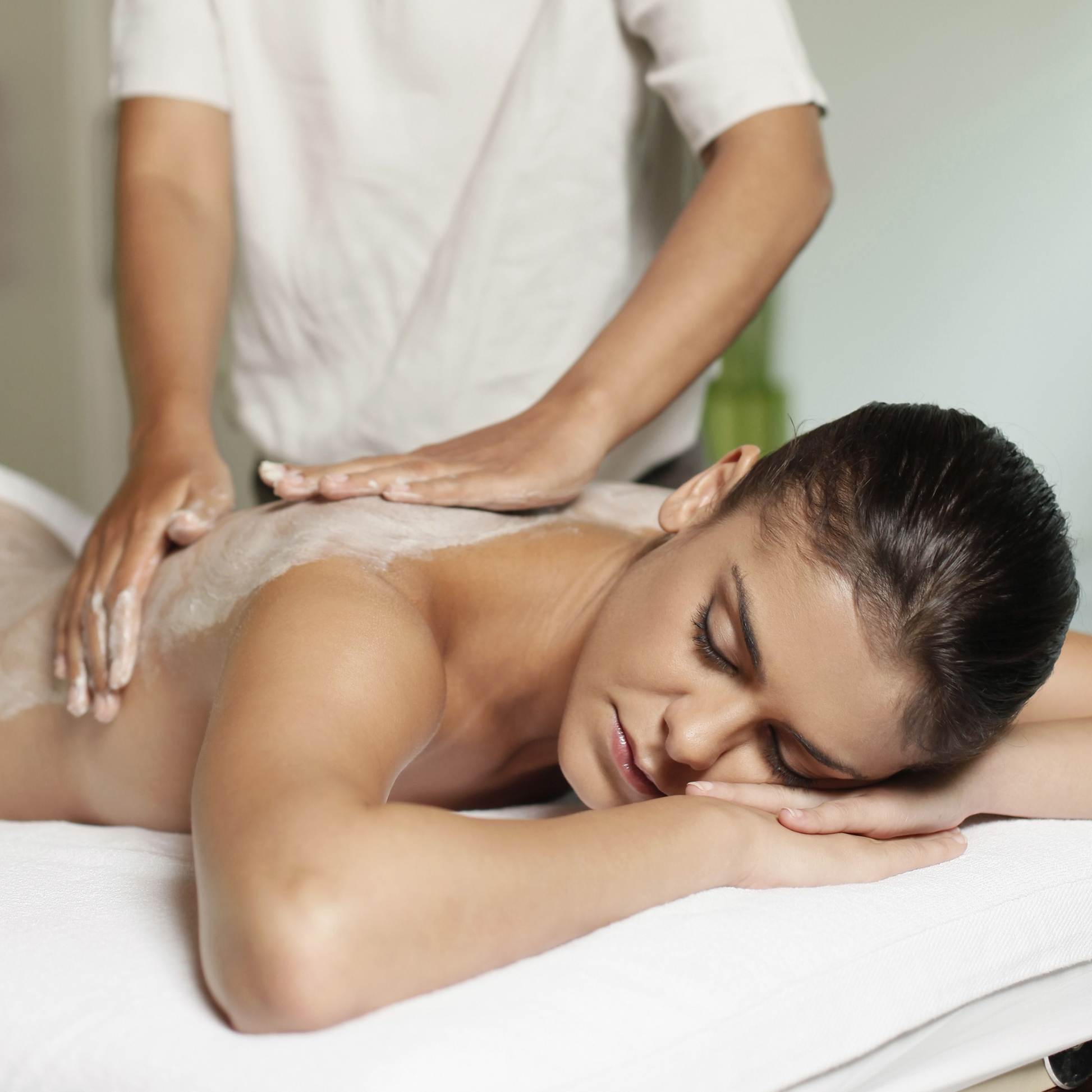 Back massage treatment for relaxation and tension relief at Modern Radiance Oregon spa.
