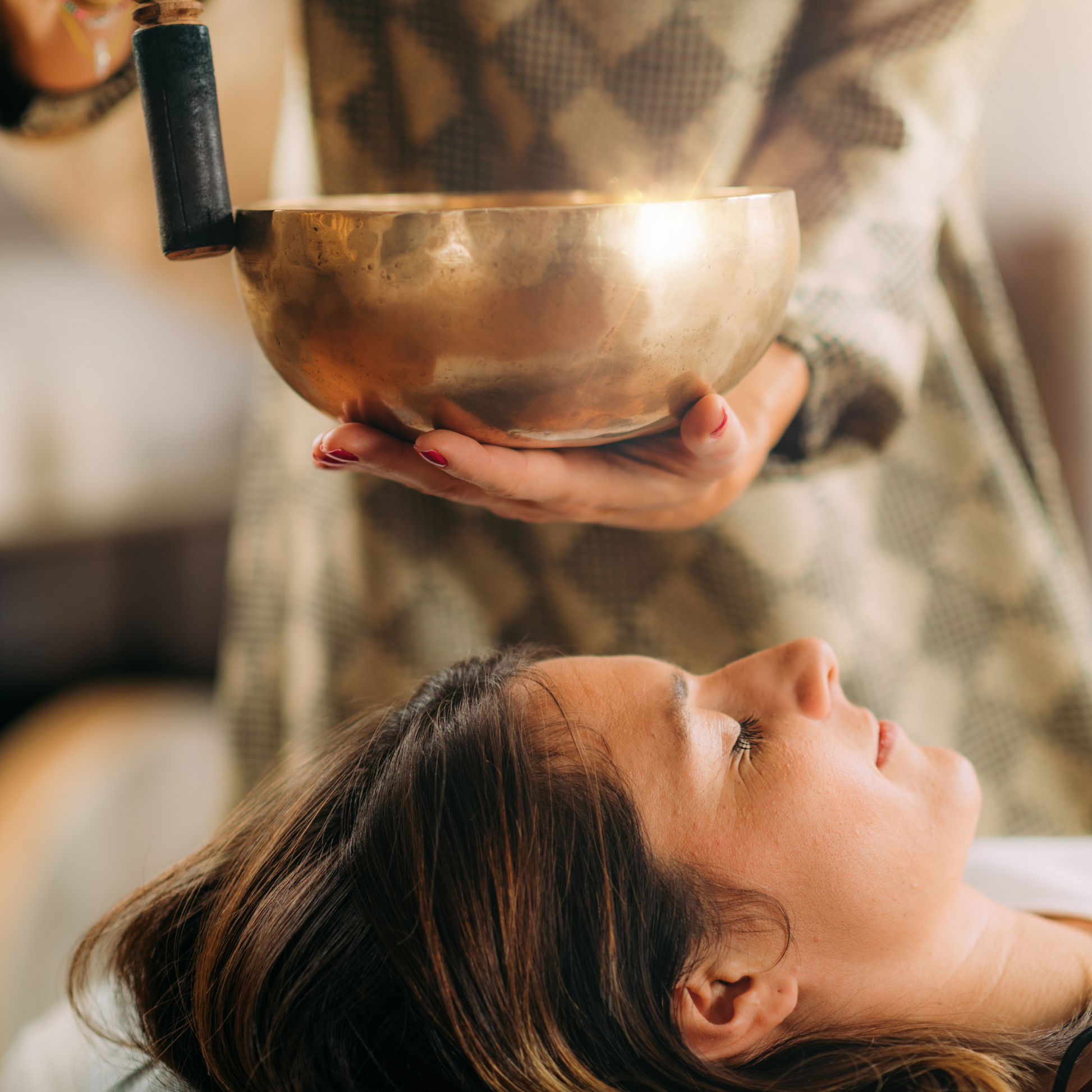 Sound healing session with singing bowls for relaxation and energy balance at Modern Radiance Oregon spa.