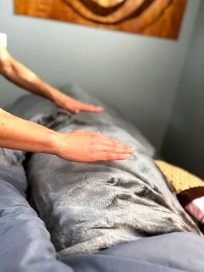 Reiki energy healing treatment promoting relaxation, stress relief, nervous system support, and holistic wellness. 